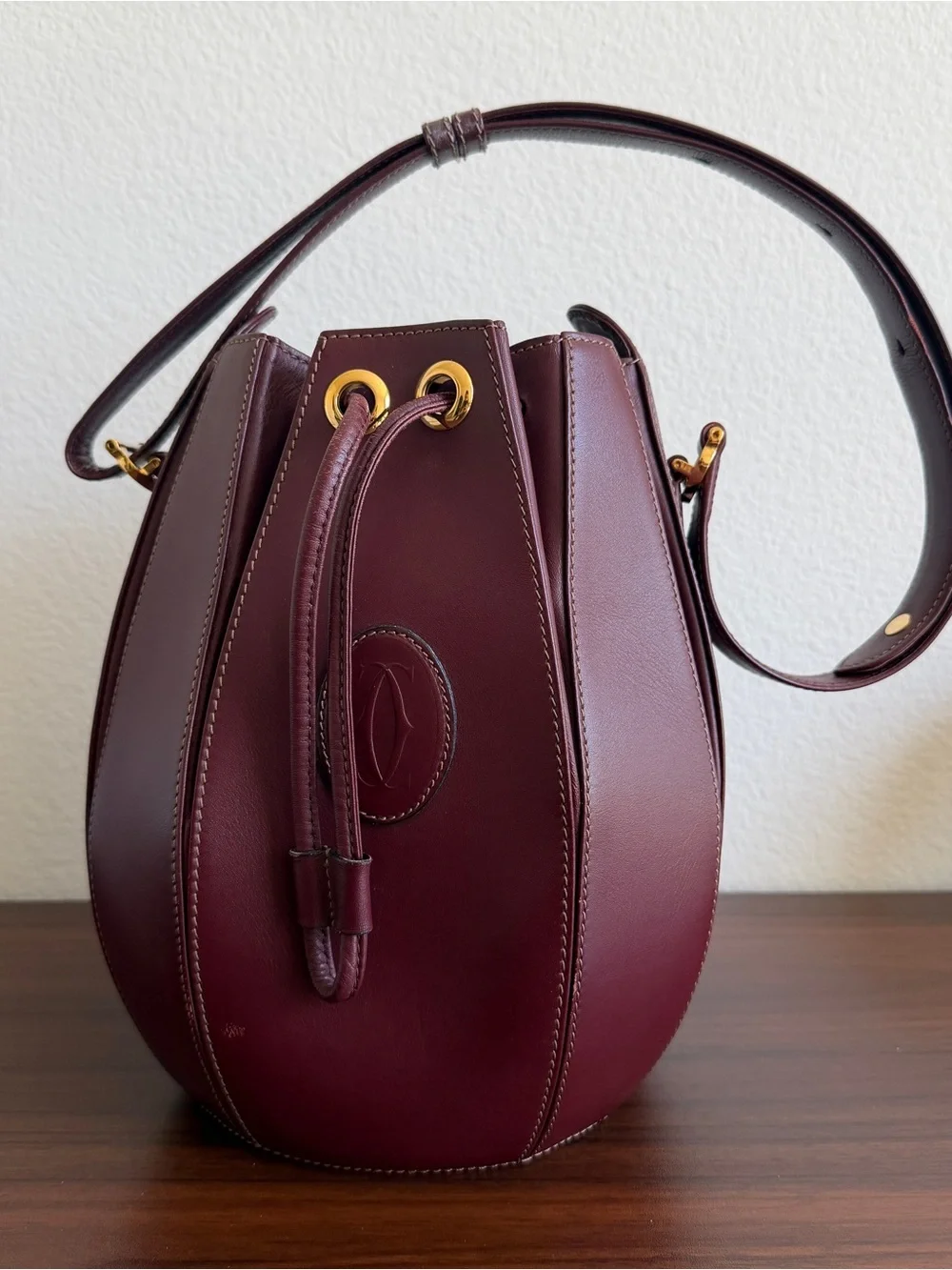 Leather Cartier Drawstring Bucket Bag in Deep Burgundy